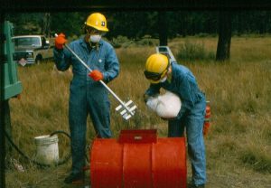 Firefighters mixing helitorch fuel