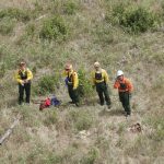 Firefighters waiting for helicopter transport