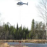Helicopter dipping water