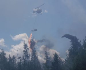 Prescribed fire helitorch at work