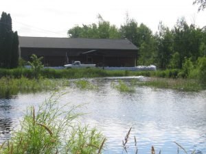 Sandbags about three feet high protect Hudrliks Carpet in Aitkin, MN during the 2012 floods.