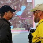 Two incident management team members discuss operations at the Green Valley Fire, 2013