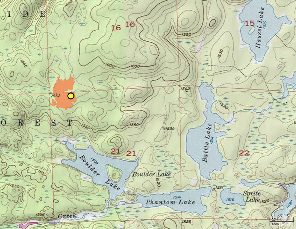 A topographic map yellow dot and orange filled boundary