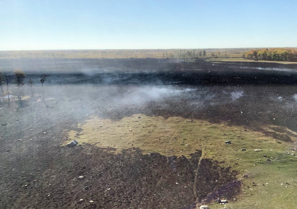 smoke rising from ground
