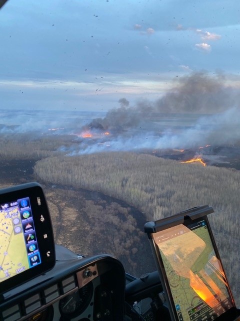 View of active fine in grassl from a vehicle with electronics.