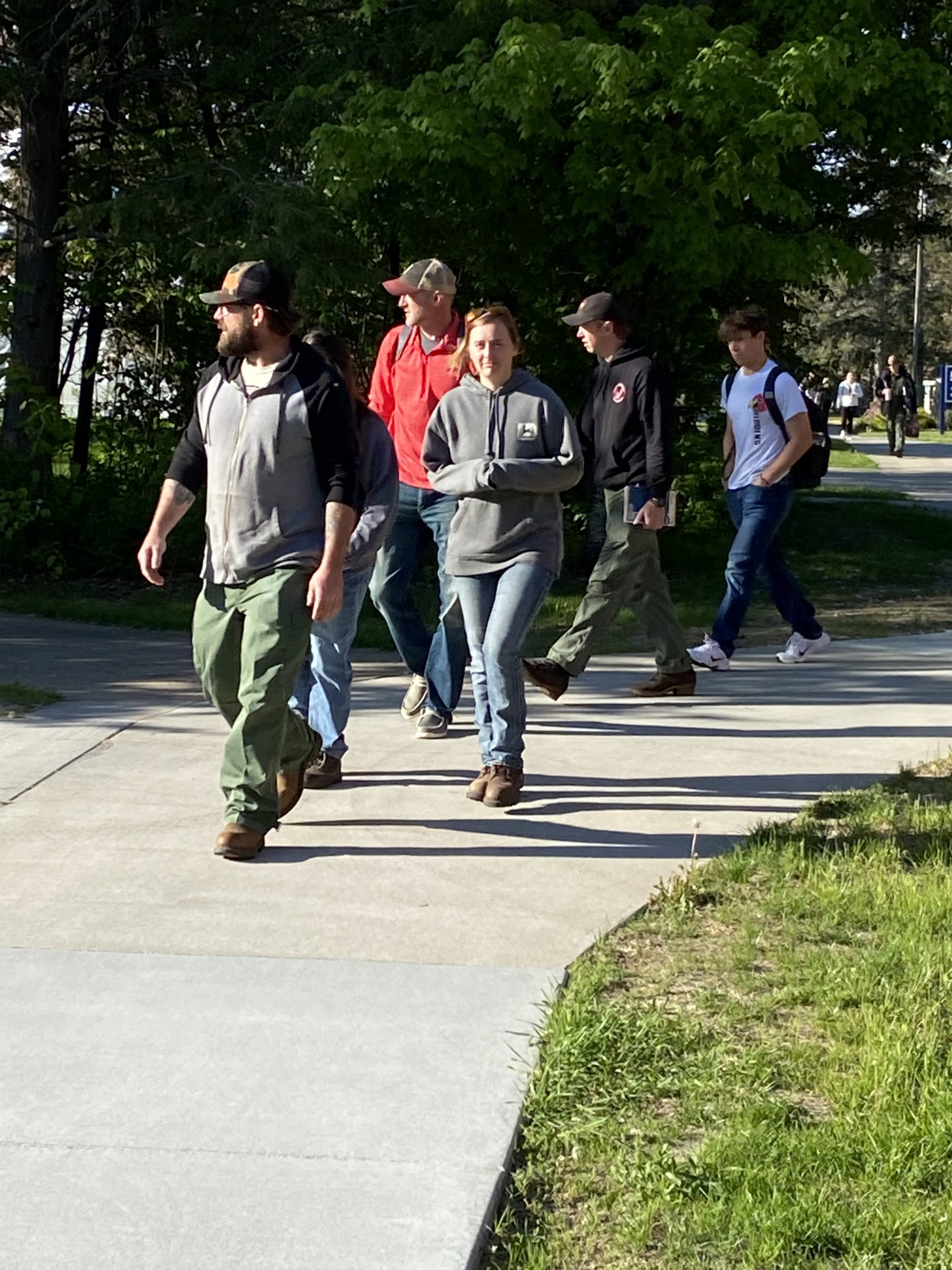People walking on a sidewalk.