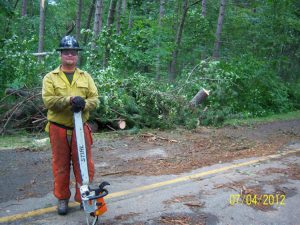 Sawyer clearing roadway, Chippewa National Forest blowdown, 2012
