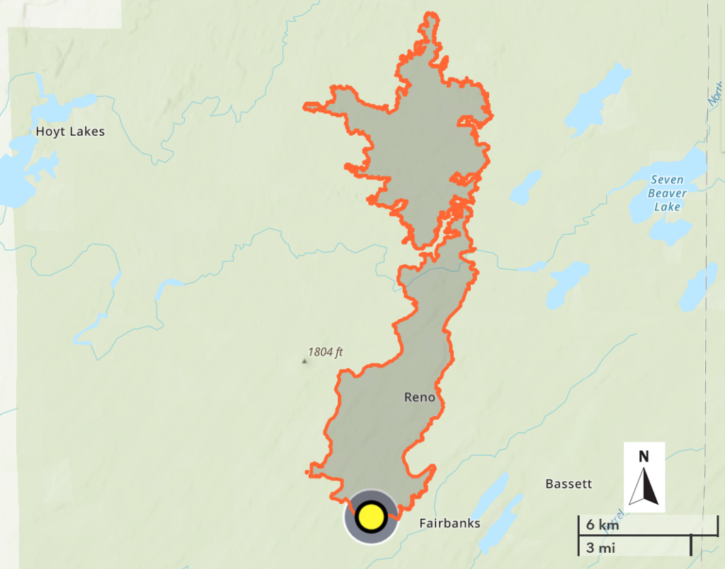 Image of a topographic map with fire boundary highlighted orange and interior shaded gray.